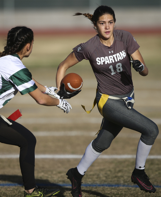 Cimarron-Memorial’s Haylie Hughes (18) runs the ball past Palo Verde’s Gianni Te ...