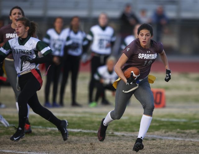 Cimarron-Memorial’s Haylie Hughes (18) runs the ball against Palo Verde during the Sun ...