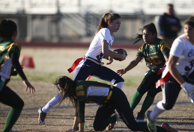 Coronado’s Caitlin Shannon (9) runs the ball against Rancho during a flag football gam ...