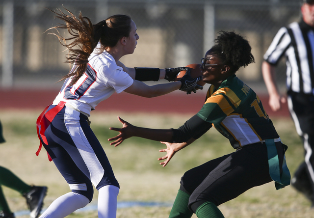 Coronado’s Trinity Rhoades (11) comes into contact with a Rancho player during a flag ...