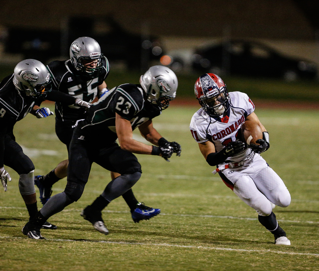 Green Valley’s Albert Lake (23) closes in on Coronado receiver Tanner Gorski on Friday ...