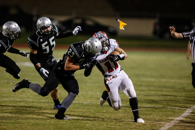 Green Valley’s Albert Lake (23) closes in on Coronado receiver Tanner Gorski on Friday ...