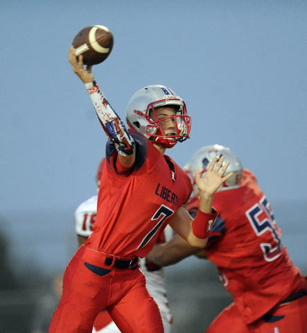 Liberty freshman quarterback Kenyon Oblad passes against Coronado in the first quarter on Fr ...