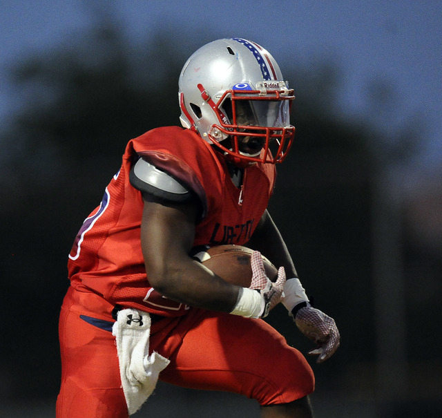 Liberty running back Darius Alston carries the ball against Coronado on Friday. (Josh Holmbe ...