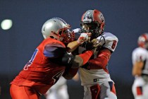 Coronado linebacker Kainoa Granstrom, right, locks up with Liberty’s Alofana Tevaseu on Se ...