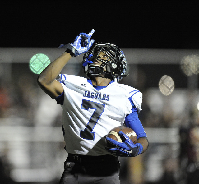 Desert Pines running back Isaiah Morris (7) celebrates his touchdown run against Faith Luthe ...