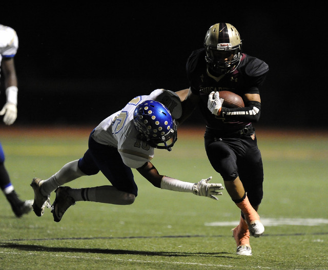 Sierra Vista safety Javion Hunt (16) tackles Faith Lutheran Crusaders wide receiver Christia ...