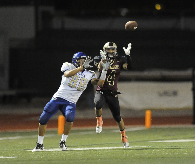 Faith Lutheran defensive back Christian Marshall (4) nearly intercepts a pass intended for S ...