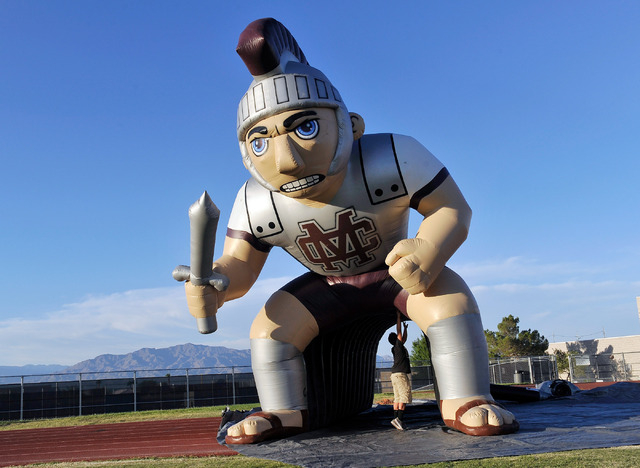 Michael Beckingham holds up The Spartan Tunnel as it is being set up before Cimarron-Memoria ...