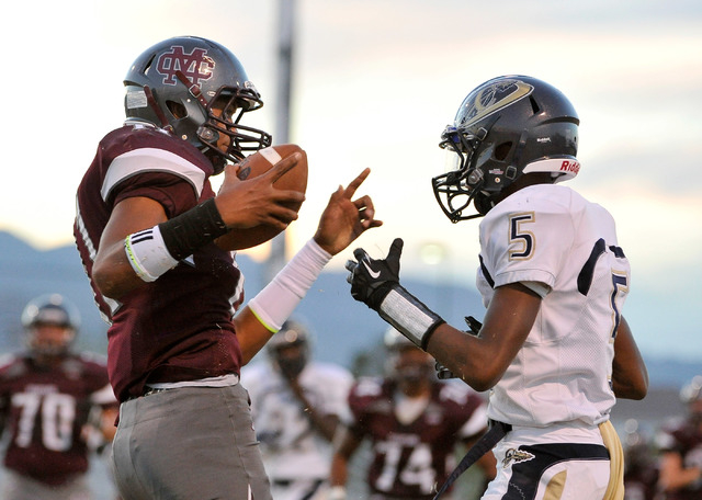 Cimarron-Memorial’s Joe Tito, left, reacts after making a reception against Cheyenne&# ...