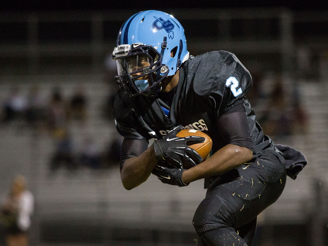 Canyon Springs’ Zaviontay Stevenson, carries the ball in the first half against Foothi ...