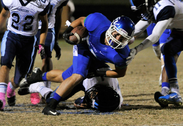 Green Valley’s Albert Lake runs the ball against Canyon Springs on Friday. Lake rushed ...