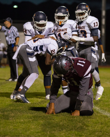 Legacy players celebrate as Cimarron-Memorial’s Joe Tito reacts to a bobbled ball on S ...