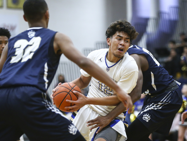 Sierra Vista forward Maui SeraJosef (12) drives past Spring Valley defense during a basketba ...