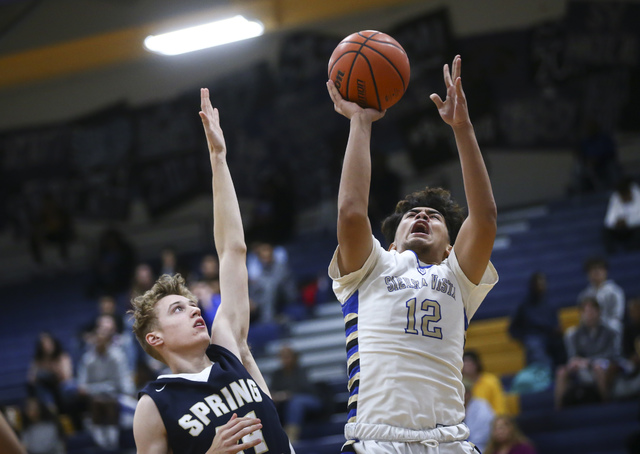 Sierra Vista forward Maui SeraJosef (12) goes up for a shot over Spring Valley forward Justi ...