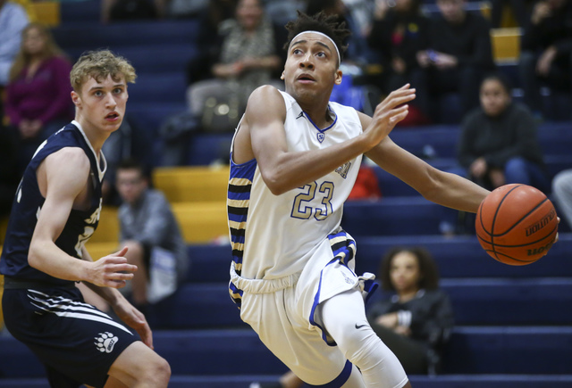 Sierra Vista forward Chris McCoy (23) drives the ball against Spring Valley during a basketb ...