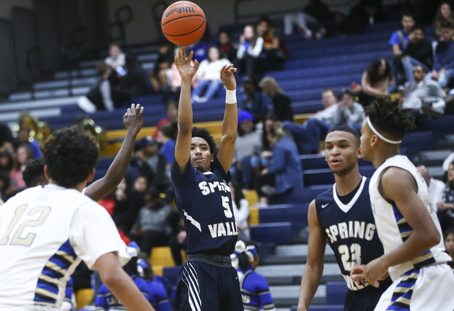 Spring Valley guard Paul Banks (5) goes up for a shot against Sierra Vista during a basketba ...