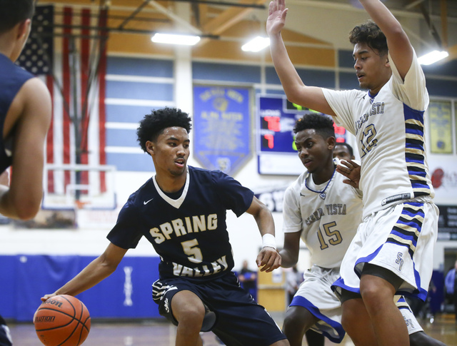 Sierra Vista guard Zekarias Kassaye (15) and forward Maui SeraJosef (12) defend against Spri ...