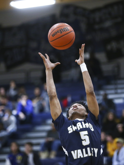 Spring Valley guard Paul Banks (5) goes up for a rebound during a basketball game at Sierra ...