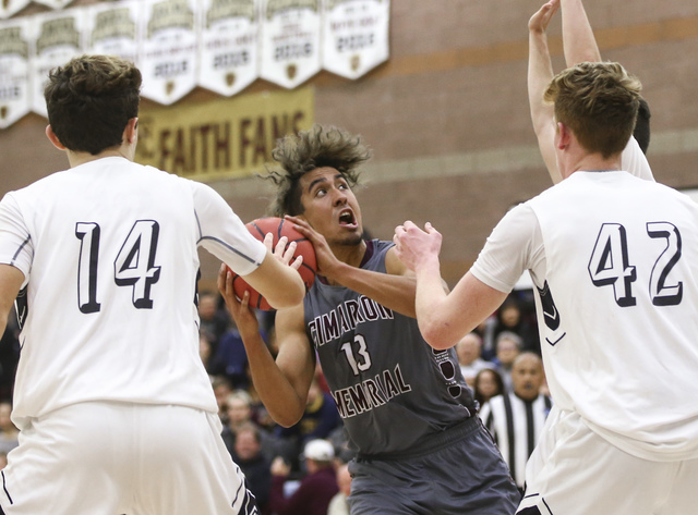 Cimarron-Memorial’s Kamakana Winquist (13) looks to shoot between Faith Lutheran&#8217 ...