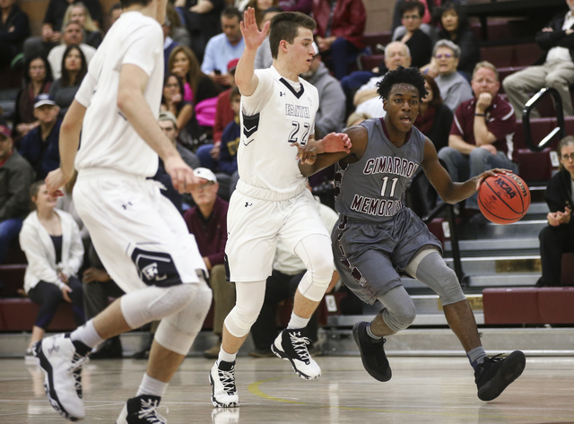 Cimarron-Memorial guard Ja’Don Brown (11) drives to the basket during a basketball gam ...