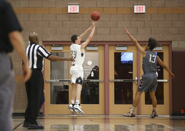 Faith Lutheran’s Brevin Walter (23) shoots to score a three-pointer against Cimarron-M ...