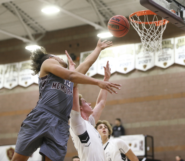 Cimarron-Memorial’s Kamakana Winquist (13) sends in a shot over Faith Lutheran during ...