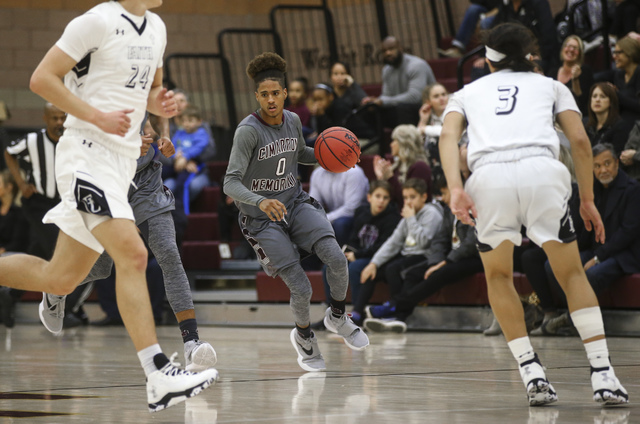 Cimarron-Memorial guard Keiron Hatchett (0) drives against Faith Lutheran during a basketbal ...