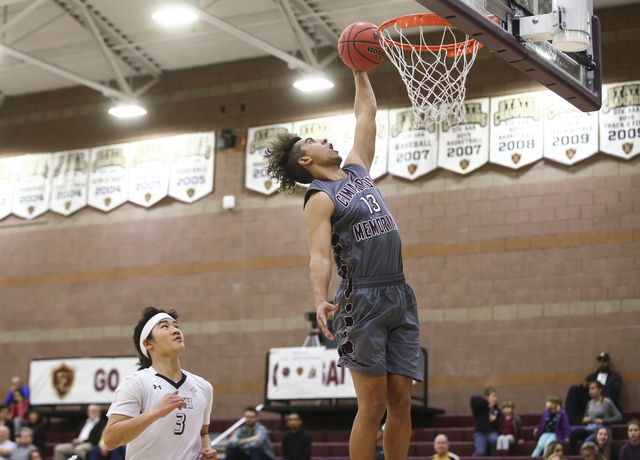 Cimarron-Memorial’s Kamakana Winquist (13) goes up for a dunk during a basketball game ...