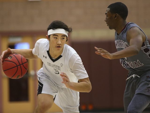 Faith Lutheran Josh Hong (3) drives the ball against Cimarron-Memorial during a basketball g ...