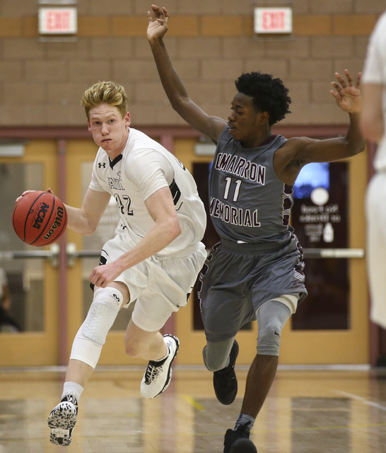 Faith Lutheran’s Elijah Kothe (42) drives against Cimarron-Memorial guard Ja’Don ...