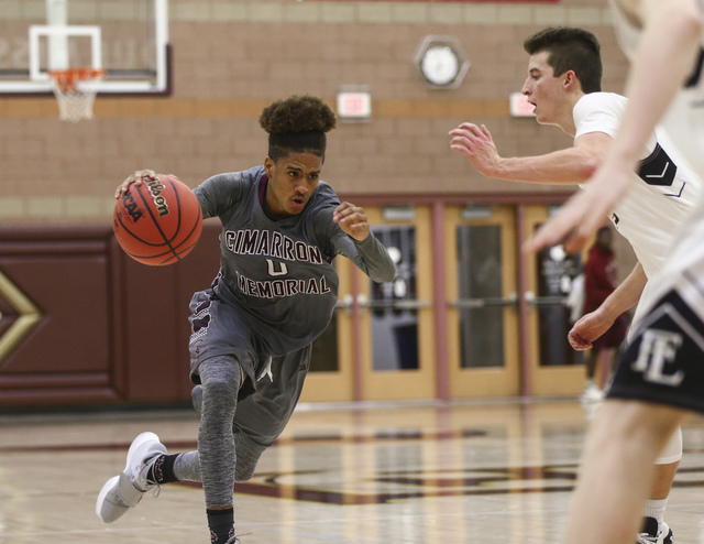 Cimarron-Memorial guard Keiron Hatchett (0) drives the ball during a basketball game at Fait ...