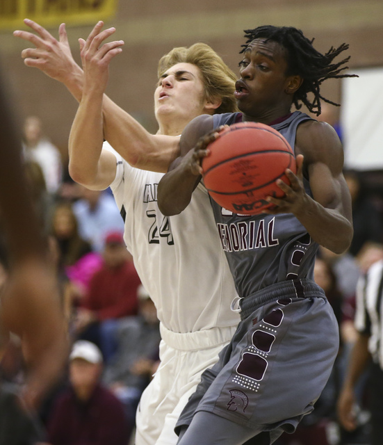 Cimarron-Memorial guard Demarco Alexander (22) gets a rebound over Faith Lutheran forward Ni ...