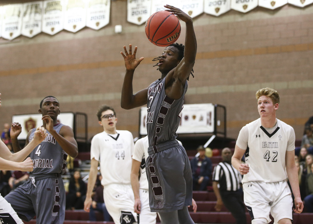 Cimarron-Memorial guard Demarco Alexander (22) gets a rebound during a basketball game at Fa ...