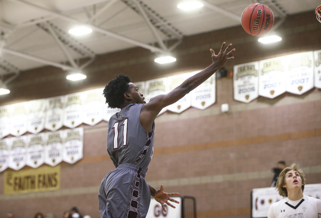 Cimarron-Memorial guard Ja’Don Brown (11) goes up for a shot during a basketball game ...