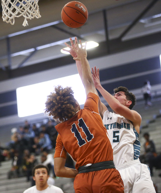 Silverado’s Caden Farley (5) sends up a shot over Legacy’s Tyrell Nolen (11) dur ...