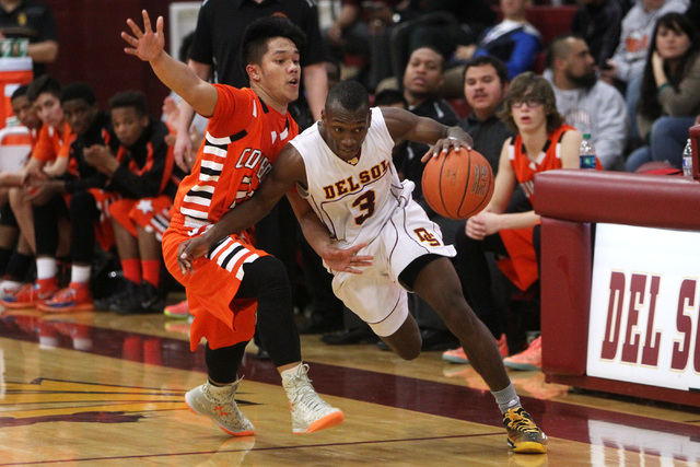 Del Sol guard Rashaun Lawson dribbles around Chaparral guard Robin Rosales on Friday. Lawson ...