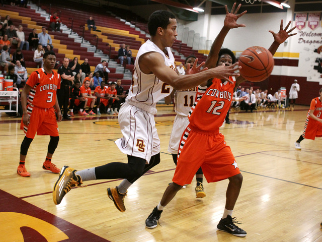 Del Sol guard Ganny Belloni keeps the ball inbounds while being defended by Chaparral center ...