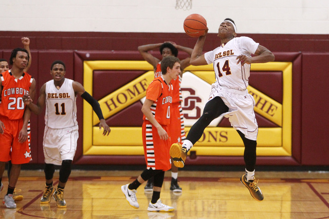 Del Sol forward Brian Greer tosses the ball as time expires in their game against Chaparral ...