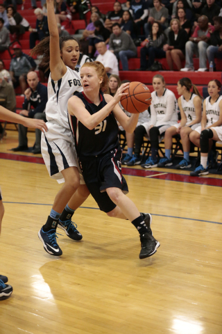 Coronado senior Karlie Thorn (31) drives past Foothill’s Katey Roquemore on Thursday. ...