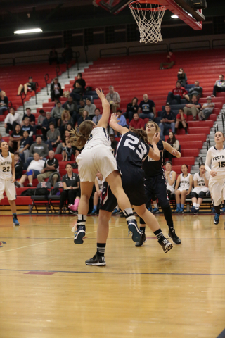 Foothill senior Mikayla Yeakel (2) comes down on Coronado senior Anastasya Youmans (23) afte ...