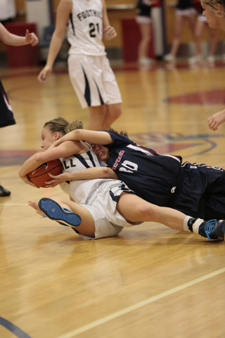 Foothill senior Mikayla Yeakel (2) and Coronado senior Dajah Washington (30) grapple for the ...