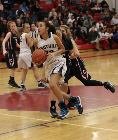 Foothill junior Katey Roquemore (22) drives to the hoop on Thursday. Roquemore had 13 points ...