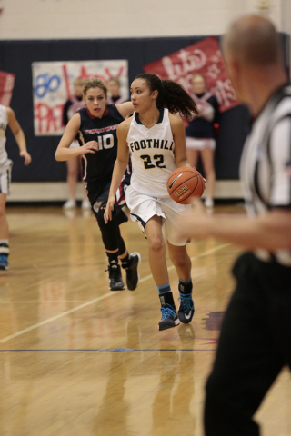 Foothill junior Katey Roquemore (22) dribbles the ball down court followed by Coronado sopho ...