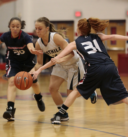 Coronado seniors Dajah Washington (30), left, and Karlie Thorn (31) defend Foothill’s ...