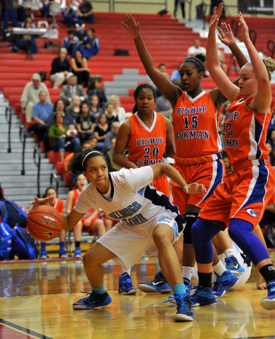 Centennial’s Jayden Eggleston, left, dribbles the ball against Bishop Gorman’s S ...