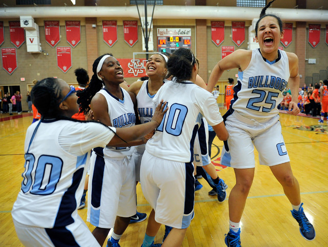 Centennial team members, led by senior Karina Brandon (25), celebrate after the Bulldogs def ...