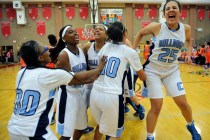 Centennial team members, led by senior Karina Brandon (25), celebrate after the Bulldogs def ...