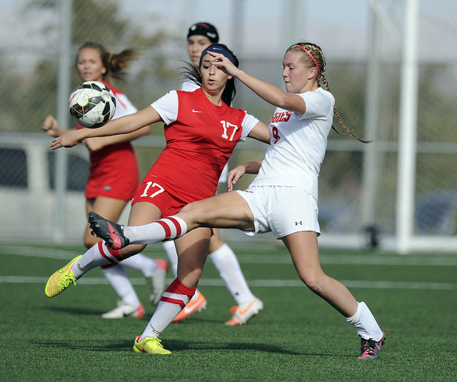 Arbor View midfielder Breanna Larkin, right, challenges Coronado defender Abby Brown (17) du ...