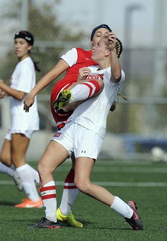 Arbor View midfielder Breanna Larkin, right, is kneed in the upper body after Coronado defen ...